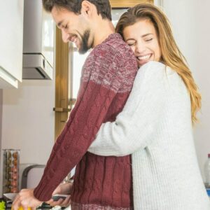 Loving couple cooking together in the kitchen at home