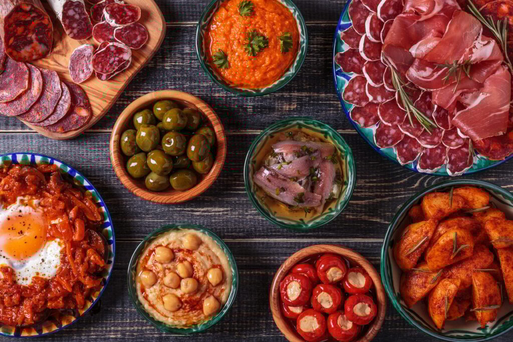 Typical spanish tapas concept, rustic style, top view.