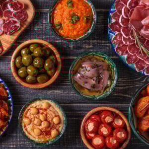 Typical spanish tapas concept, rustic style, top view.