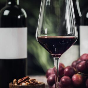 Bottles Of Red Wine, Wine Glasses And Grapes